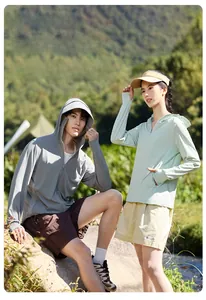 Detail of outdoor sun protection hoodies with thumb holes in grey and light green colors