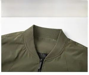 Detail of army green jacket featuring a ribbed collar and smooth metal zipper closure