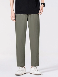 Pantalon homme en soie glacée vert olive avec cordon de serrage pour sport décontracté