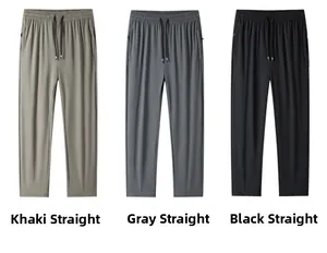 Close-up of khaki, grey, and black quick-dry pants featuring elastic drawstring waistbands