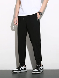 Men's black ice silk joggers with drawstring waist and breathable stretch fabric