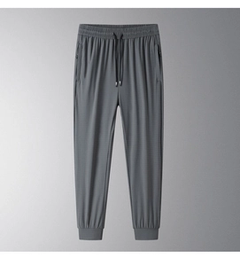 Detail view of men's ice silk joggers featuring micro-grid texture and elastic drawstring waist