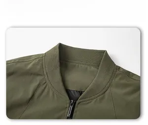 Detail view of military green bomber jacket with ribbed collar and metal zipper