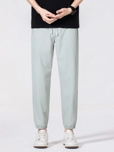 Men's lightweight mint green ice silk casual pants with drawstring waist and elastic cuffs