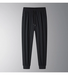 Close-up of black ice silk joggers featuring elastic waistband and adjustable drawstring
