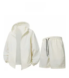 Detail view of cream white sun protection set featuring hooded jacket and matching shorts