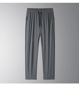 Detail of grey ice silk pants showing elastic waistband and zipper pocket texture