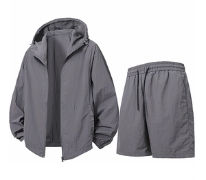 Detail of gray men's sun protection set showing hooded jacket and shorts with drawstrings