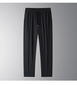 Detailed view of elastic waistband and drawstring on black ice silk men's pants