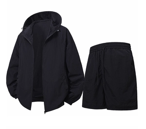 Detail of a lightweight black hooded sun protection sports jacket and shorts set for men