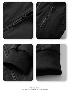 Detail of men's slim fit jacket showing zipper pockets and ribbed cuffs in black fabric