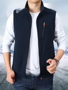Close-up of men's dark blue fleece vest with a vertical zipper chest pocket and stand collar