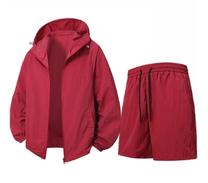 Detail of dark red sun protection jacket with elastic cuffs and matching shorts