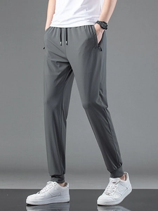 Men's ice silk quick-dry joggers with elastic drawstring waist and breathable mesh fabric