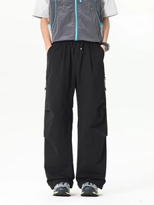 Pantalon cargo noir à jambes larges avec cordon de serrage et poches fonctionnelles amples