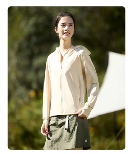 Detail of lightweight beige sun protection jacket with hood and functional thumb holes