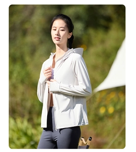 Detail of white hooded sun protection jacket with thumb holes for outdoor sports