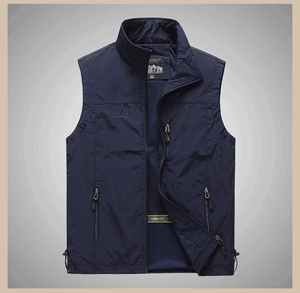 Detail of outdoor vest with breathable blue mesh lining and multiple zipper pockets