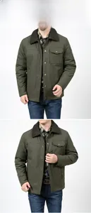 Detail view of olive green jacket with thick faux sheepskin collar and chest embroidery