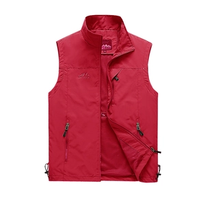 Detail of red outdoor vest showing breathable mesh lining and interior size M label