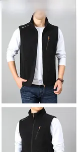 Detail view of black fleece vest featuring vertical zip pocket and standing collar design
