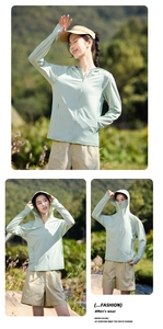 Detail of light green sun protection jacket featuring hooded zipper and hand cover cuffs