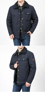 Detail of navy men jacket with fleece collar, multiple pockets and embroidered chest text