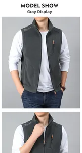 Close-up of men's dark grey fleece vest featuring high collar and zip chest pocket