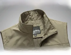 Close-up of windproof stand collar with breathable mesh lining on men's outdoor utility vest