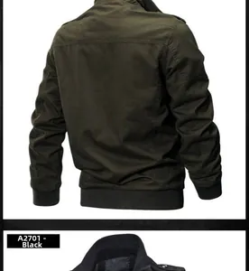 Detail view of military green and black N1 naval deck jackets with ribbed collar and cuffs