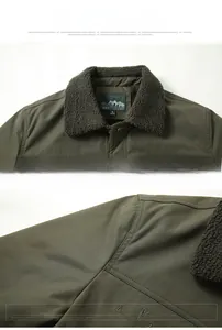 Detail of olive green jacket with sherpa collar and high-quality shoulder embroidery