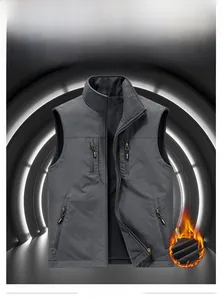 Detail view of gray reversible fleece vest showing zip pockets and stand collar