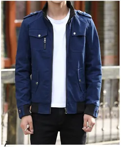 Detailed view of men's dark blue utility jacket with stand collar and flap pockets