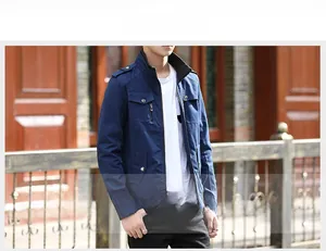 Detail of navy blue workwear jacket showing shoulder tabs and fleece inner lining