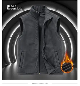 Detail of black reversible fleece vest with stand collar and thermal heating feature