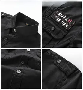 Detail of black military cargo shirt with buttoned flap pockets and woven logo label