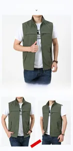 Detail view of olive green outdoor vest showing multiple pockets and durable stand-up collar
