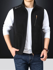 Men's black fleece vest with stand collar and zipper pockets for winter warmth