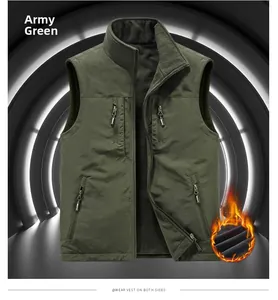Detail view of army green reversible fleece vest with stand collar and zipper pockets