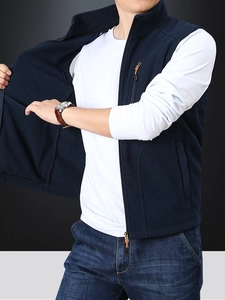 Men's navy blue fleece vest with stand collar and zipper pockets for winter layering