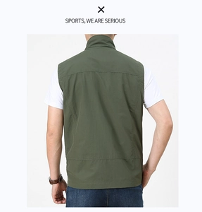 Rear view of dark green outdoor fishing vest showing shoulder seams and standing collar