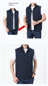 Detail view of navy blue outdoor fishing vest with full zipper and zip side pockets