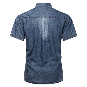 Back view of men's short-sleeved blue denim shirt with classic washed finish and pleat
