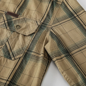 Men's khaki plaid long sleeve cotton shirt featuring utility pocket and leather patch detail
