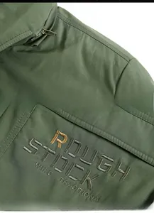 Detail of military green workwear jacket featuring embroidery and premium metal zipper
