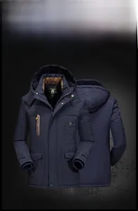 Detail view of winter hooded parka showing the brown fleece lining and zippered pockets
