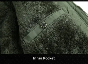 Detailed close-up of warm fleece lining and interior pocket on olive green men's winter jacket