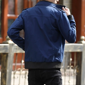 Back view of navy blue cargo jacket with fleece lining and ribbed cuffs for men