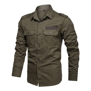 Detail of army green tactical work shirt with chest pockets and shoulder epaulets