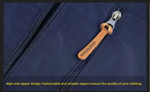 Detailed macro view of outdoor jacket metal zipper featuring a brown leather puller